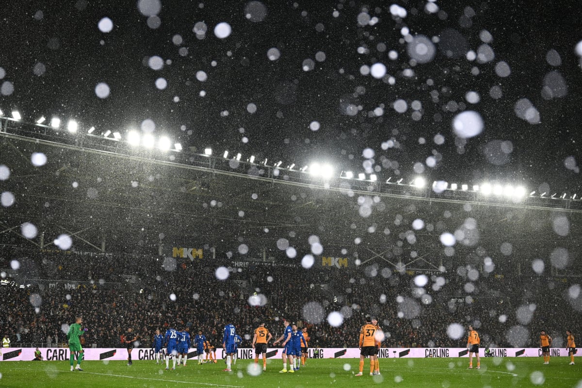 Snow falls during the English FA Cup fourth round football match between Hull City and Chelsea