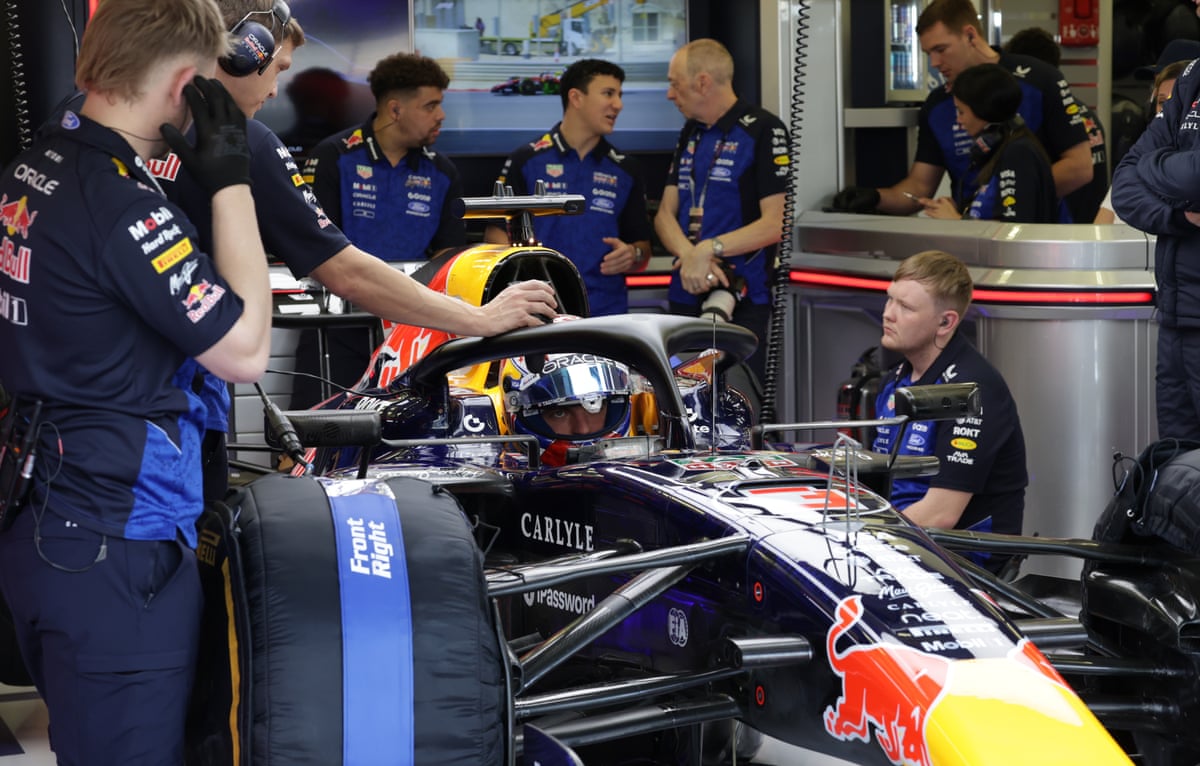 Mechanics work on Max Verstappen’s Red Bull in Bahrain