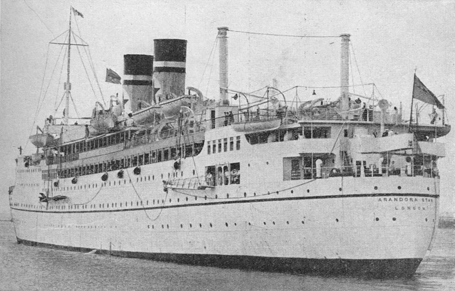  An old picture of the ship the Arandora Star with two funnels and flags flying