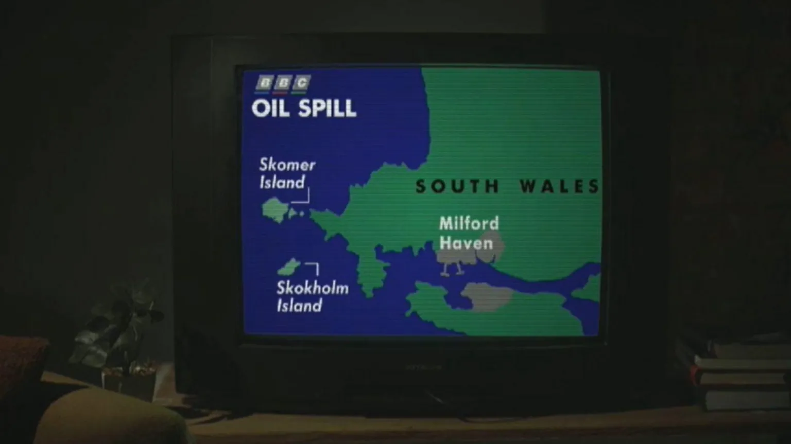 Black Waters: The Sea Empress Disaster A TV showing a news piece from 1996 illustrating where the Sea Empress had run aground. 