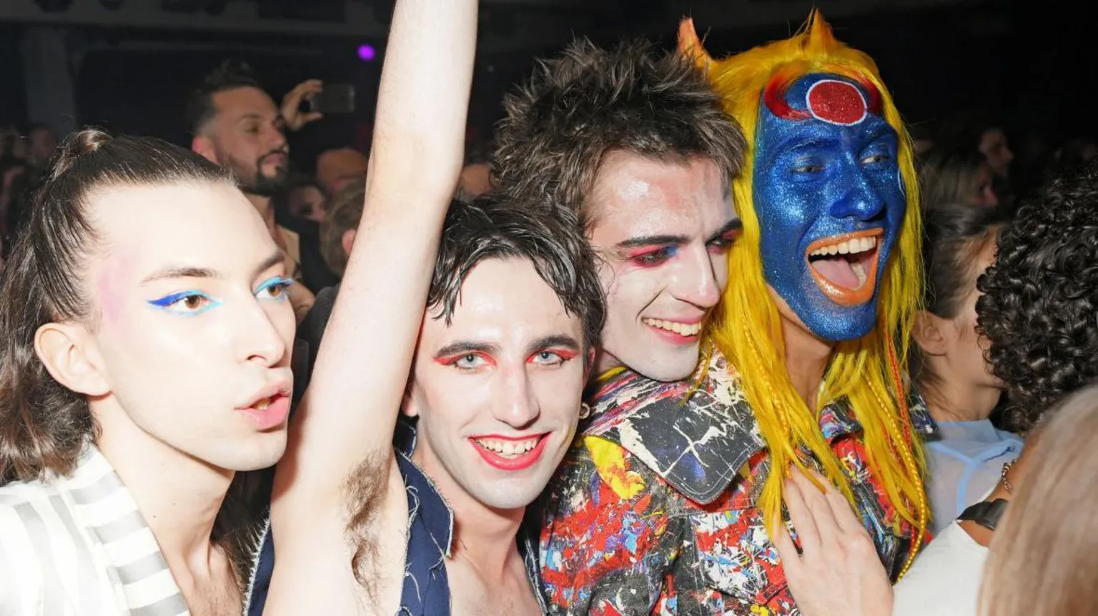  Charles Jeffrey sporting a painted denim look with blue face-paint, he is out clubbing with friends.