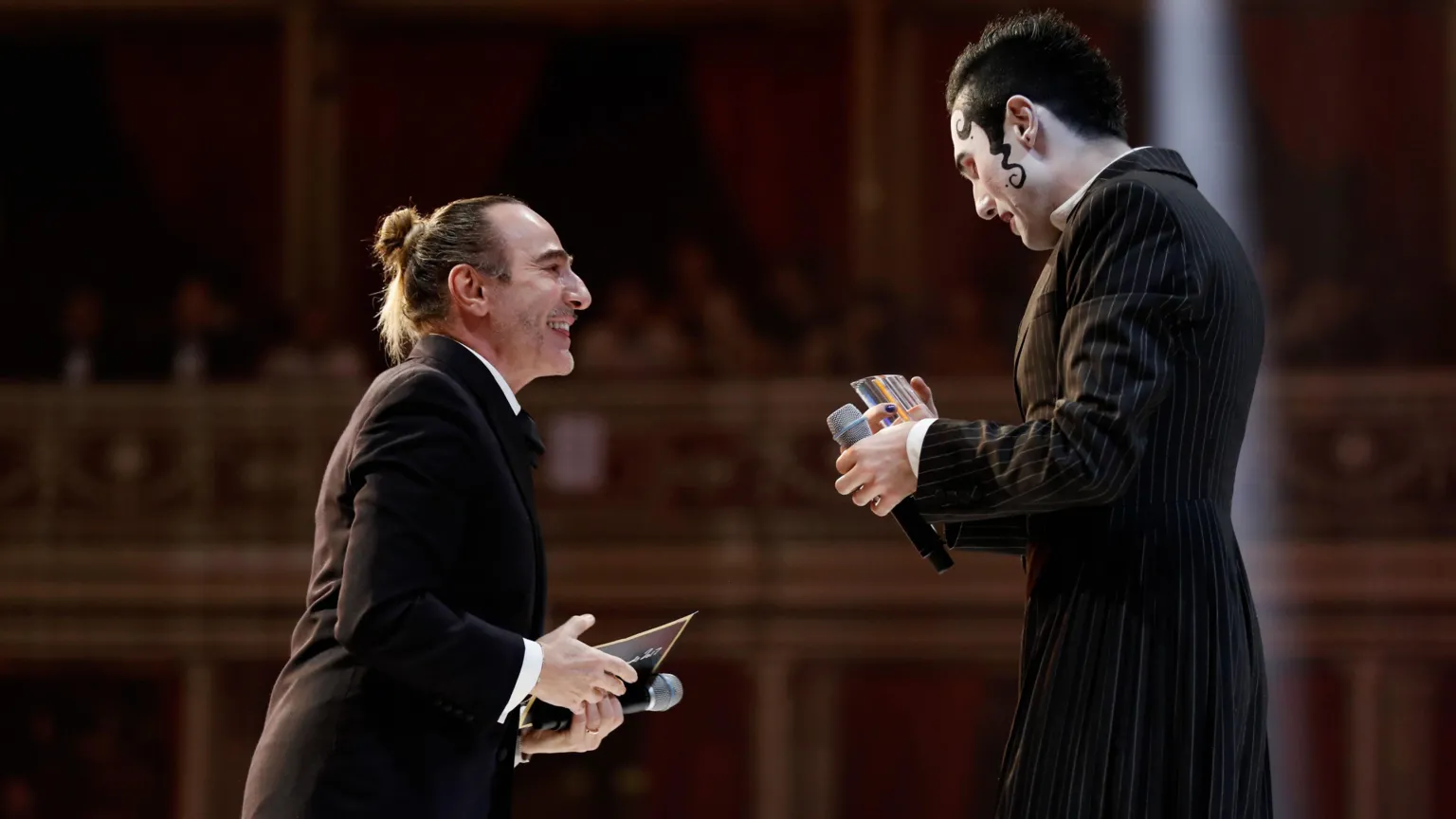  Jeffrey being handed his British Emerging Talent Menswear award by long time inspiration John Galliano.