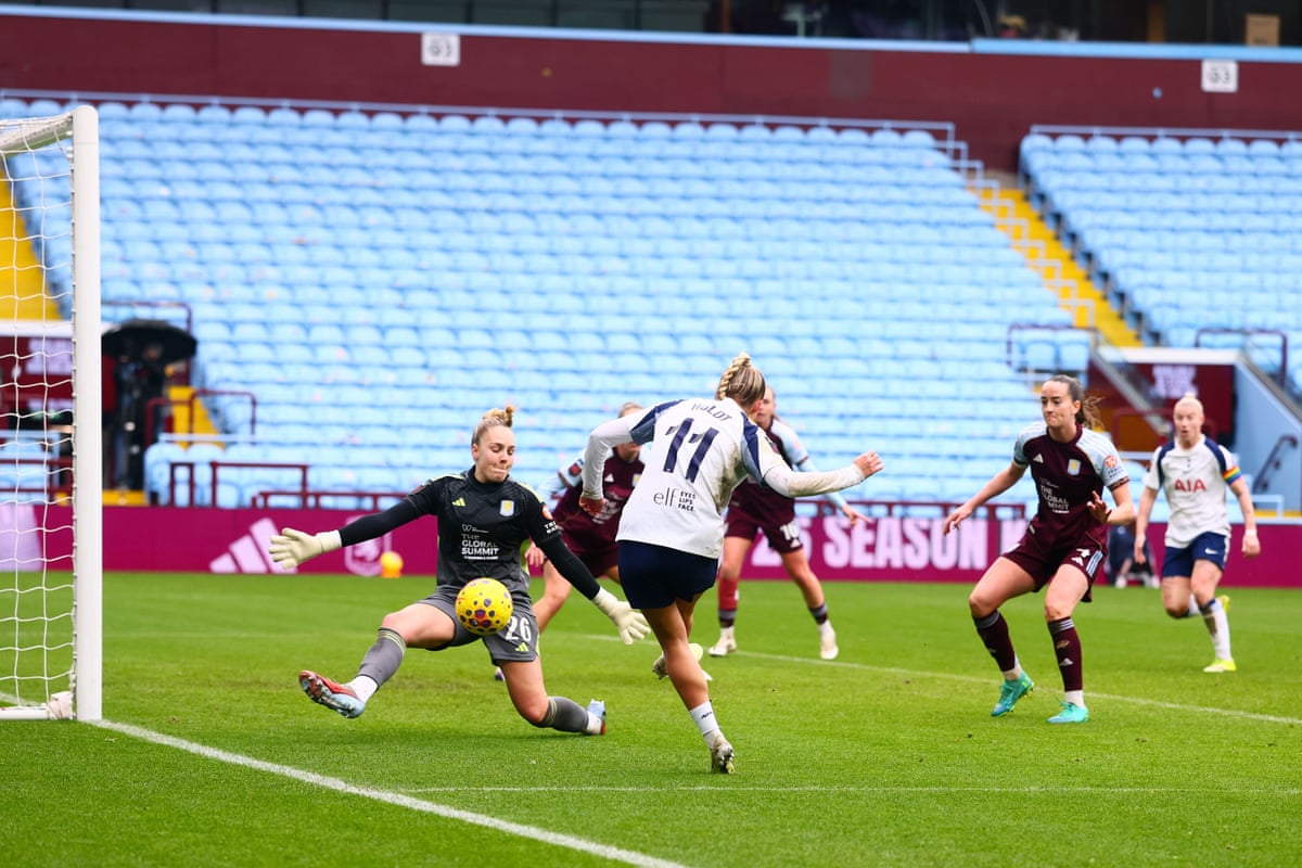 Holdt of Tottenham scores.