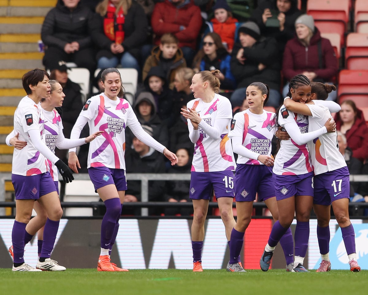 Parris celebrates scoring with her teammates.