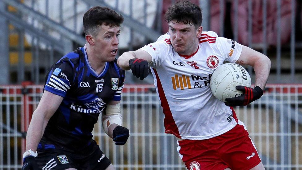 Aidan Clarke bursts past Dara McVeety