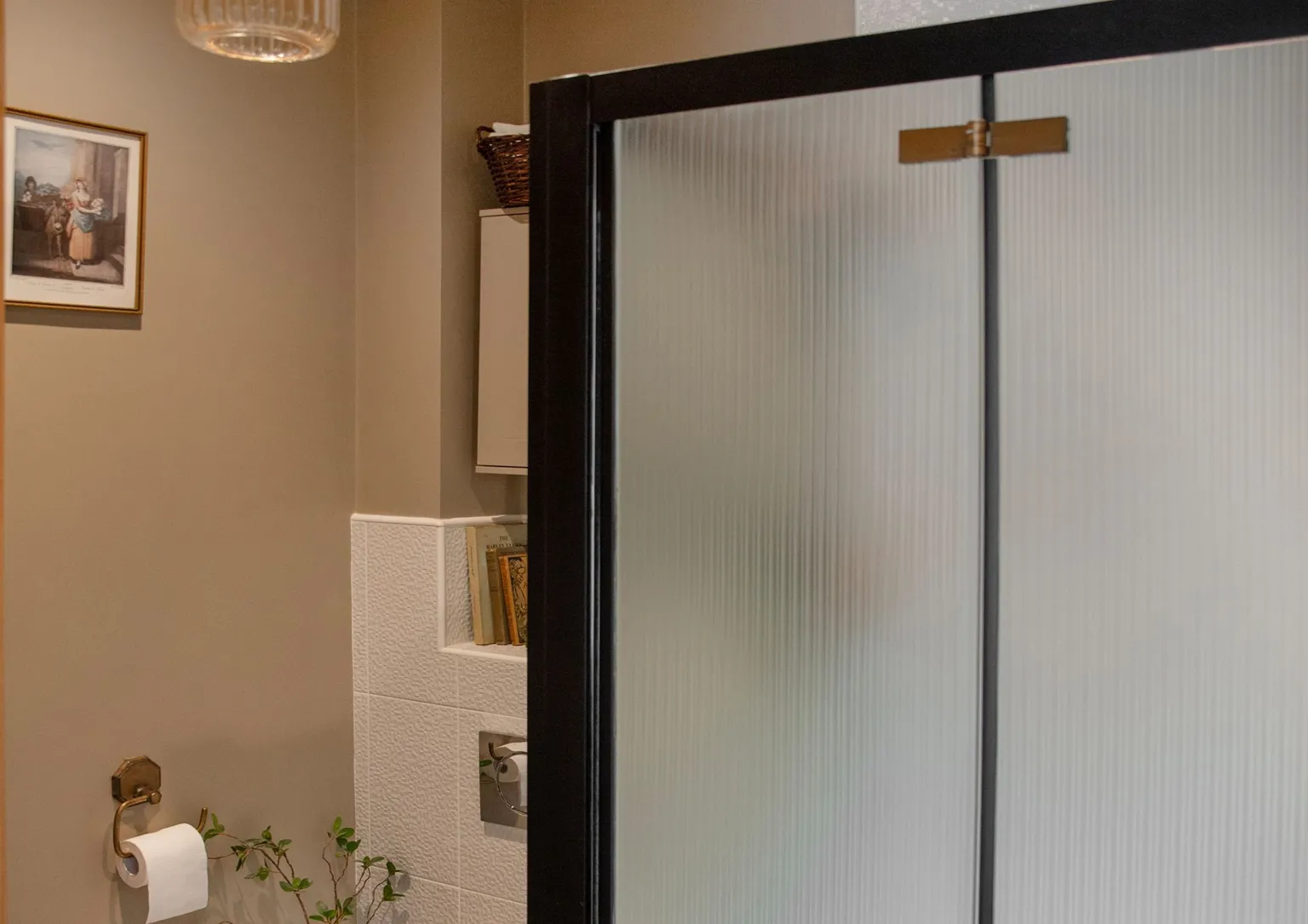 The Lovely Drawer A black shower cubicle with reeded glass effect panels 