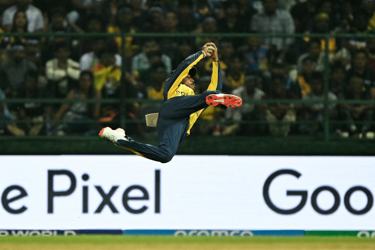 Sri Lanka's Pathum Nissanka takes a catch to dismiss Australia's Glenn Maxwell.