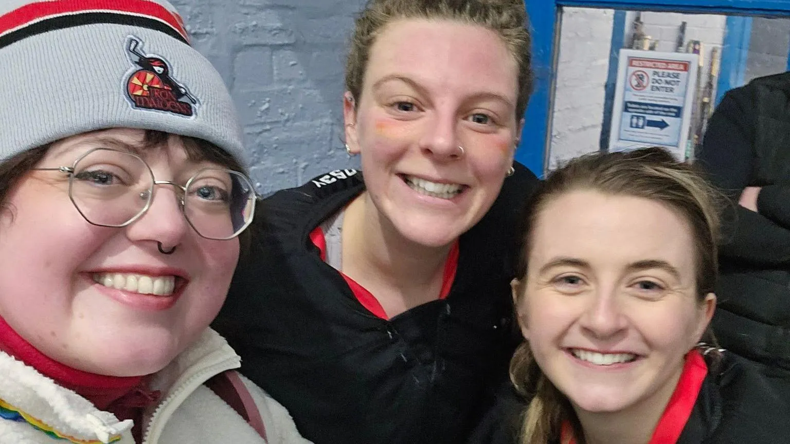 Georgia Grainger Three women wrapped up warm smiling at the camera.