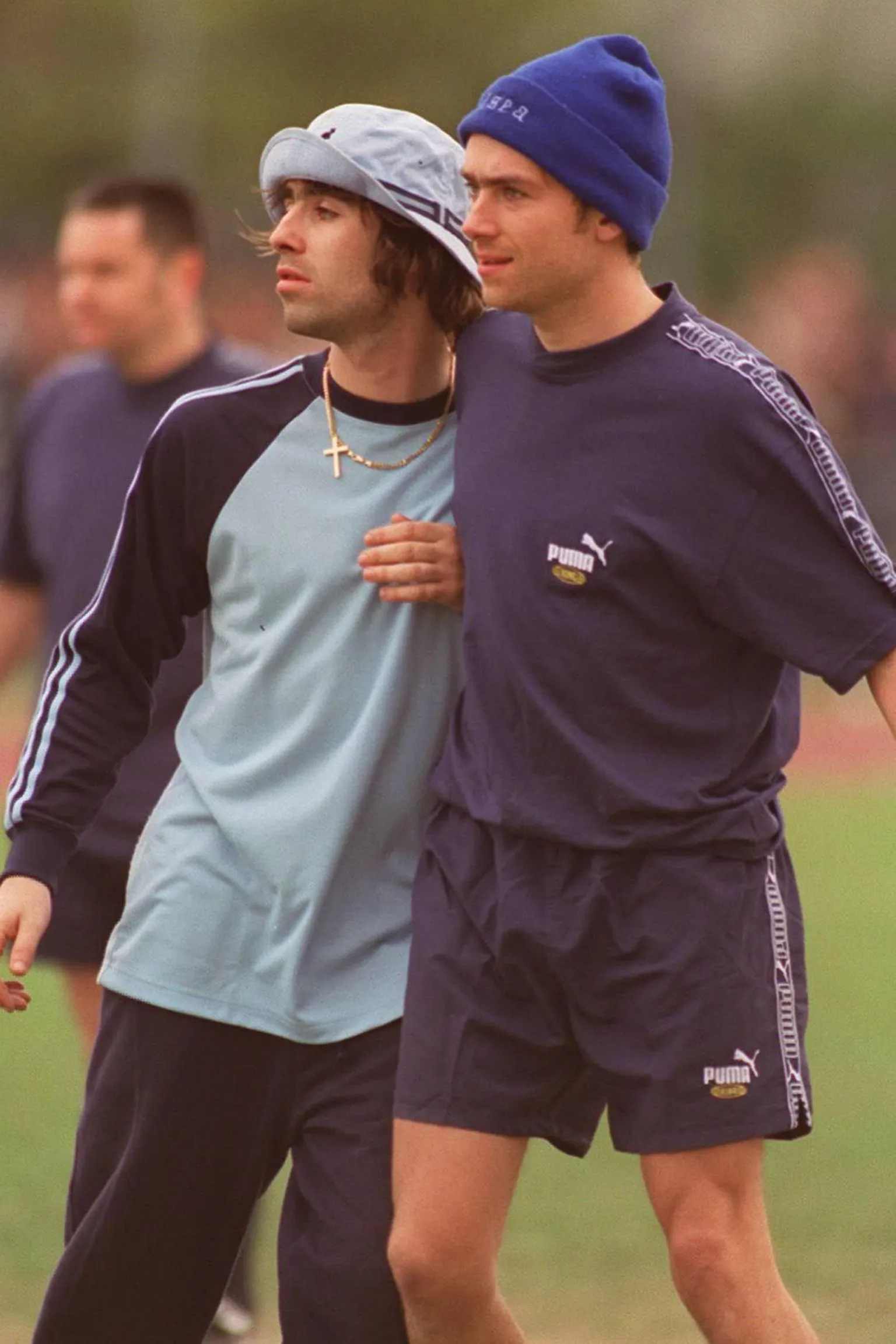  Liam Gallagher jostling Damon Albarn during a music industry celebrity football match