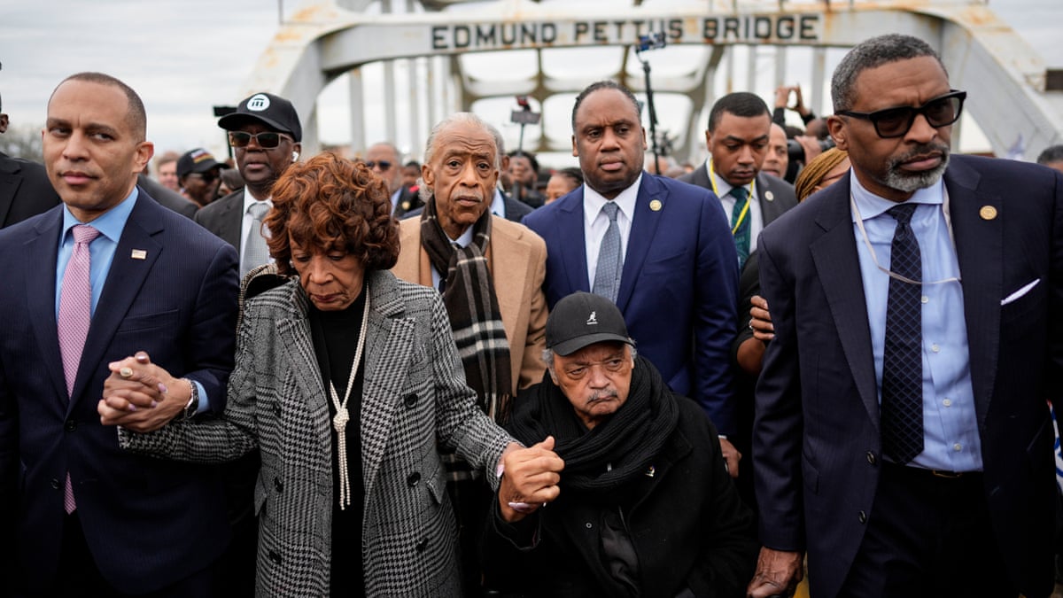 Hakeem Jeffries (L), Maxine Waters, Rev. Al Sharpton, Jesse Jackson and NAACP President Derrick Johnson march across the Edmund Pettus Bridge in Selma in 2025.