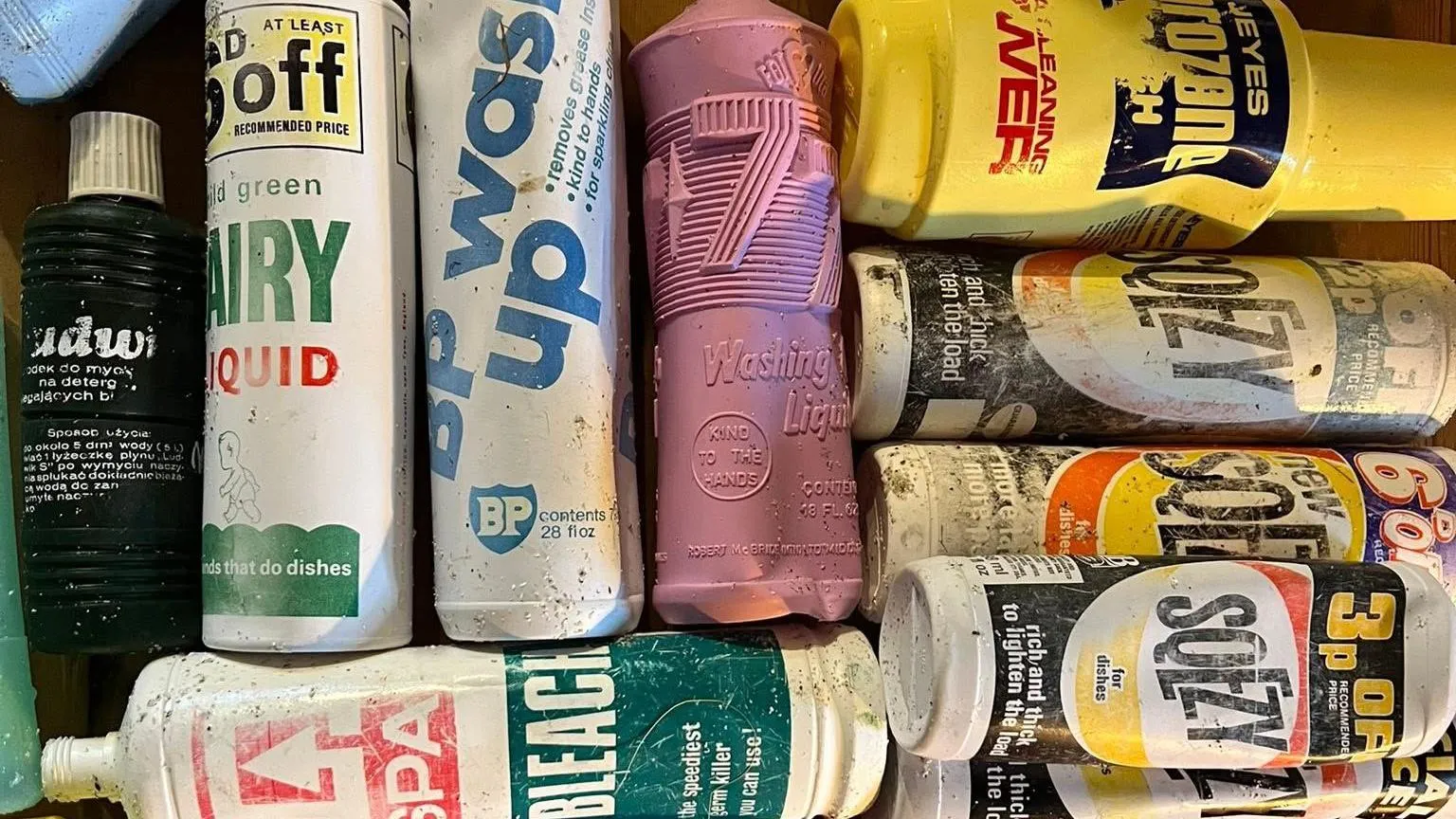 Sanday Community Craft Hub Ten differently branded plastic bottles retrieved from the beach in Sanday lie alongside one another. Some are emblazoned with a 