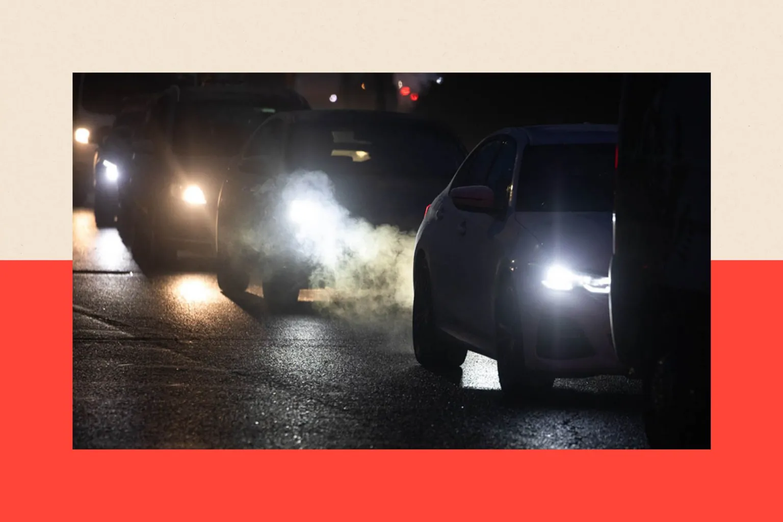  A queue of cars illuminated by their headlights in Brentwood, Essex