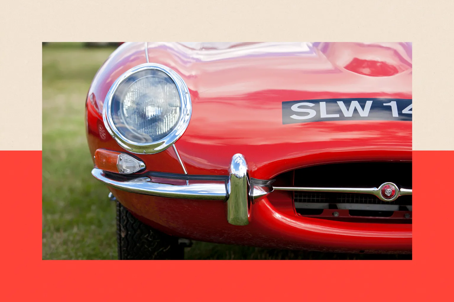  A close-up view of a headlight of a Jaguar E Type classic car, pictured at Goodwood