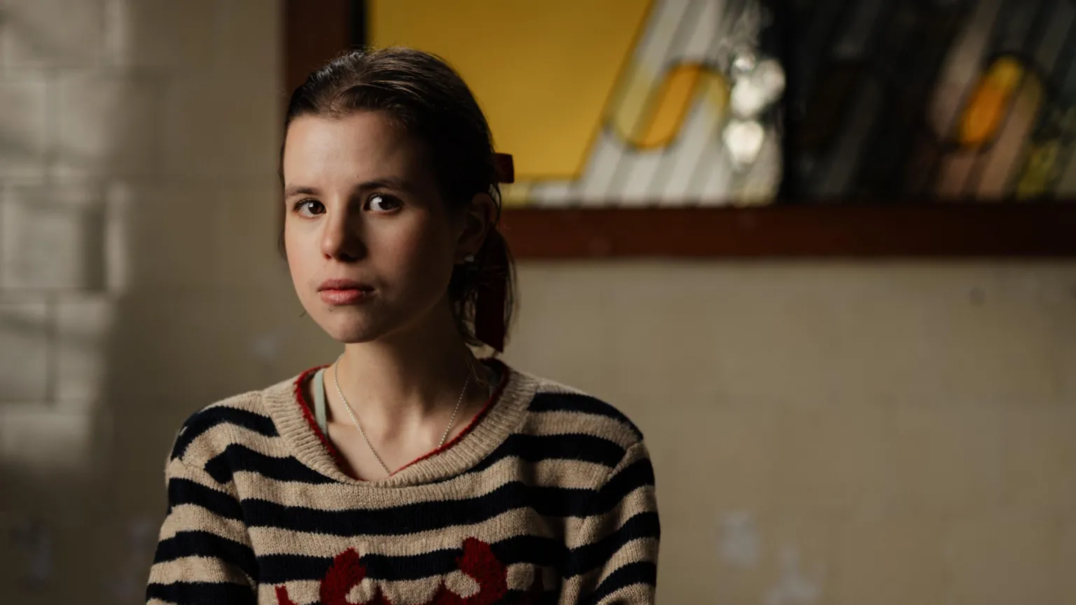 Gavin Hopkins Woman with black hair and stripy top