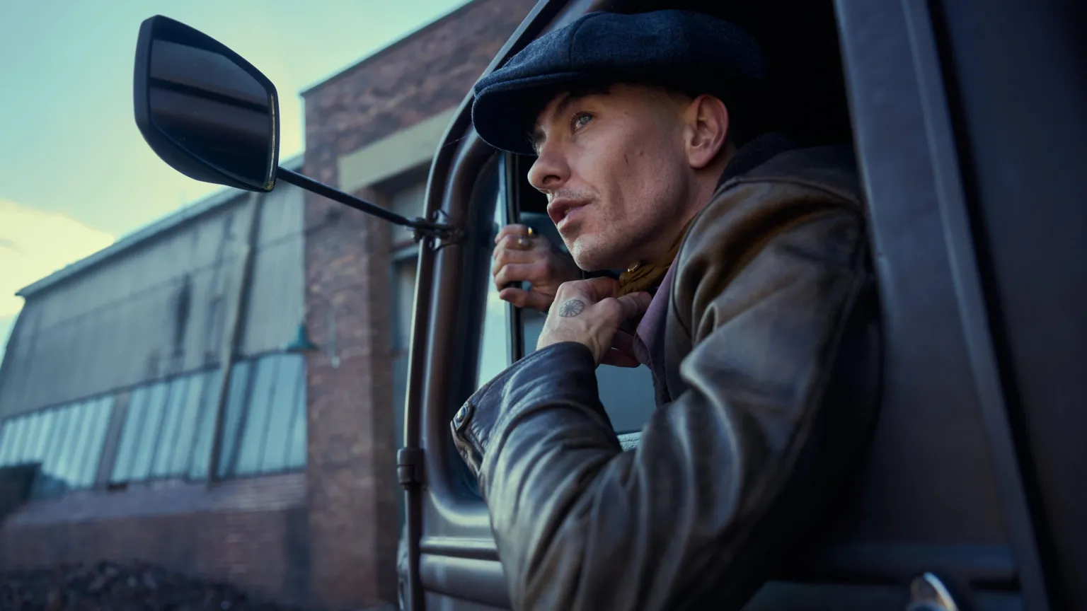 Netflix Barry Keoghan leaning out of a truck window in a scene from The Immortal Man