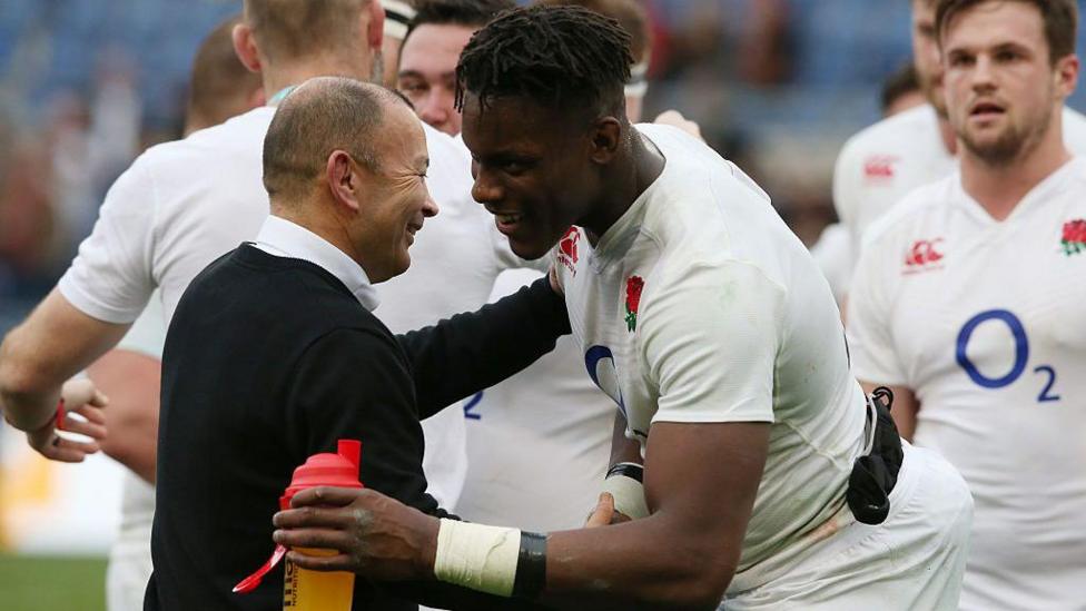 Maro Itoje hugging Eddie Jones