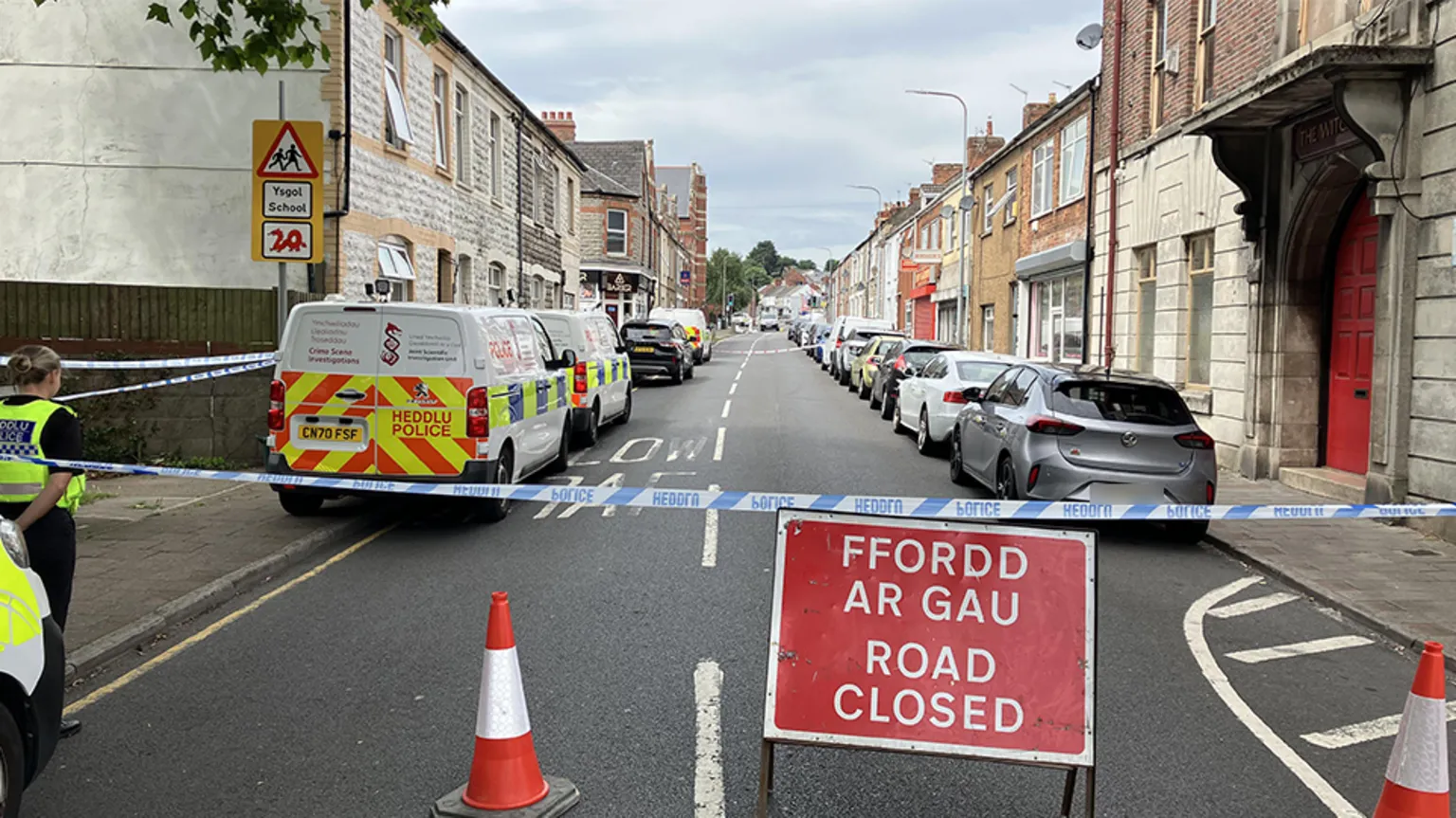 A terraced street in Barry south Wales where Kamran Aman was murdered. The image shows Barry Road closed to traffic and pedestrians the day after the racist attack.