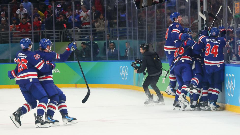 USA wildly celebrate Quinn Hughes' overtime winner against Sweden in the quarter-final