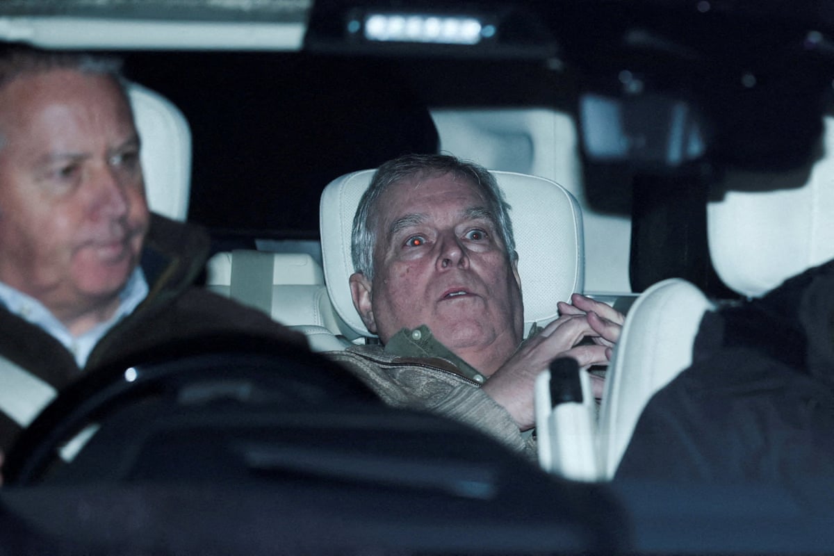 Andrew Mountbatten-Windsor slumped down in the back of a car with the driver in the front seat