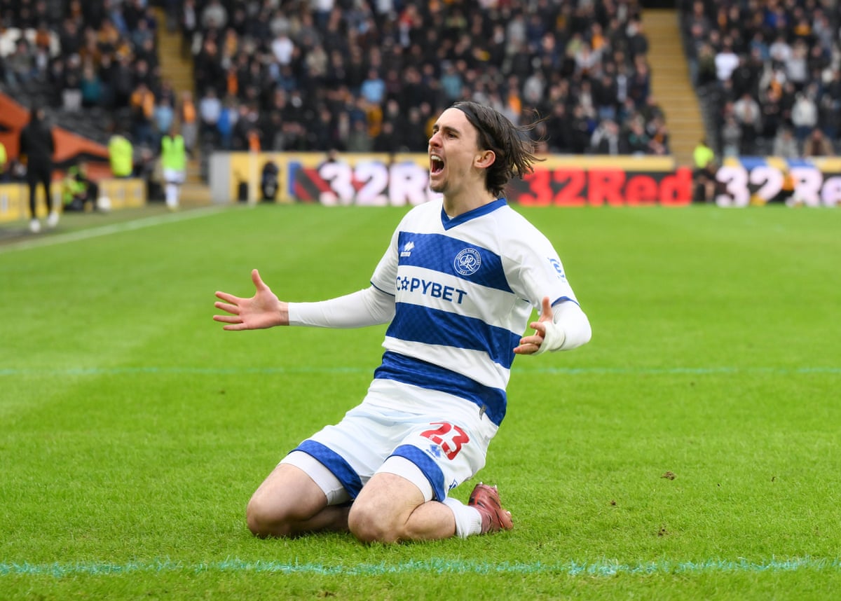 QPR’s Daniel Bennie celebrates his goal with a knee slide.
