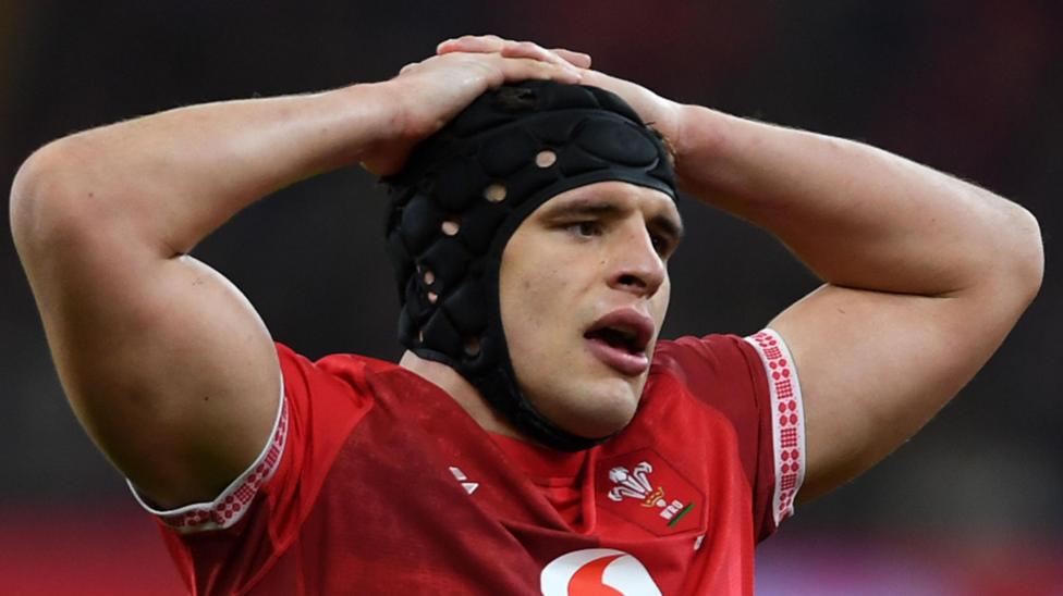 Wales lock Dafydd Jenkins with his hands behind his head