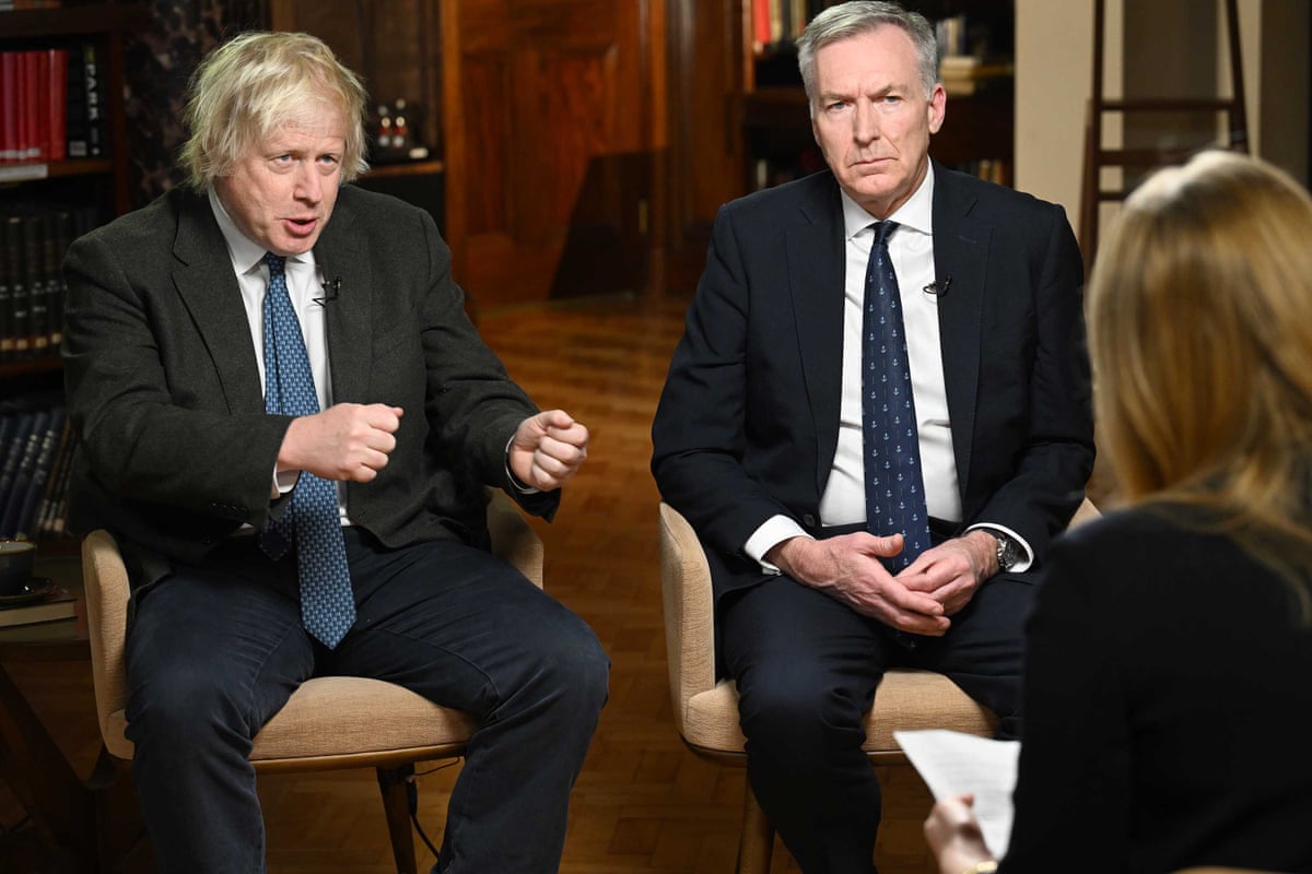 Former prime minister Boris Johnson (L) and former head of the military Adm Sir Tony Radakin (R) being interviewed by Laura Kuenssberg.