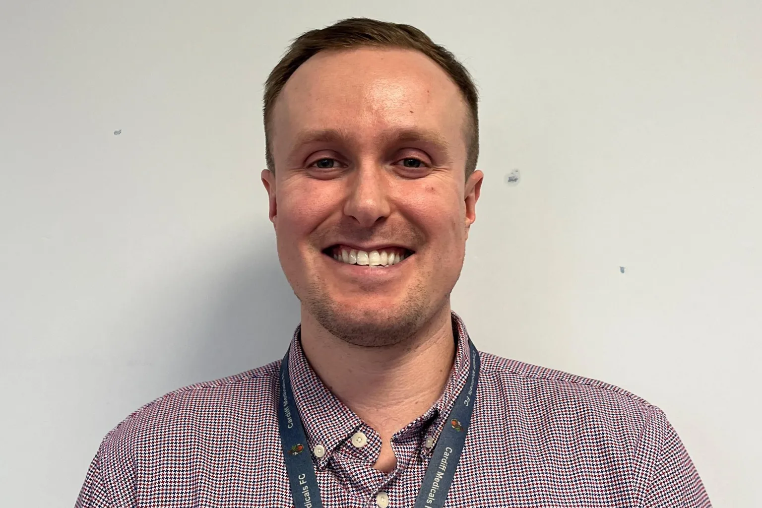 Jack Tagg Jack Tagg smiles at the camera. he is wearing his hospital lanyard.