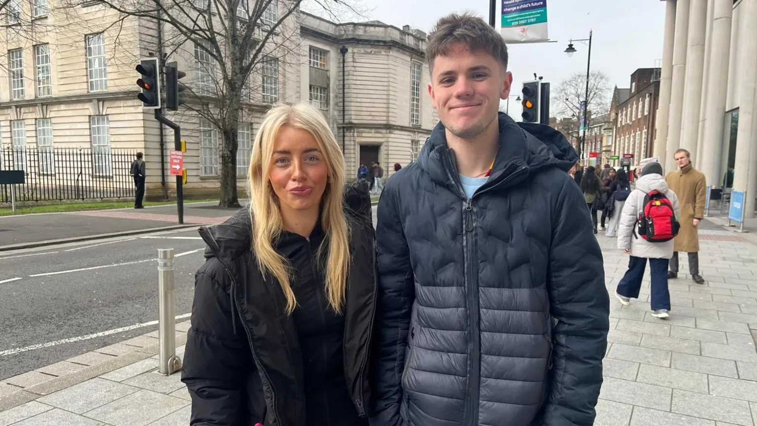Robbie Wells, 20, from Hertfordshire, studies Law. Libbie Thomas, 20, from Maesteg, studies Law. they are stood outside Cardiif University and smiling at the camera