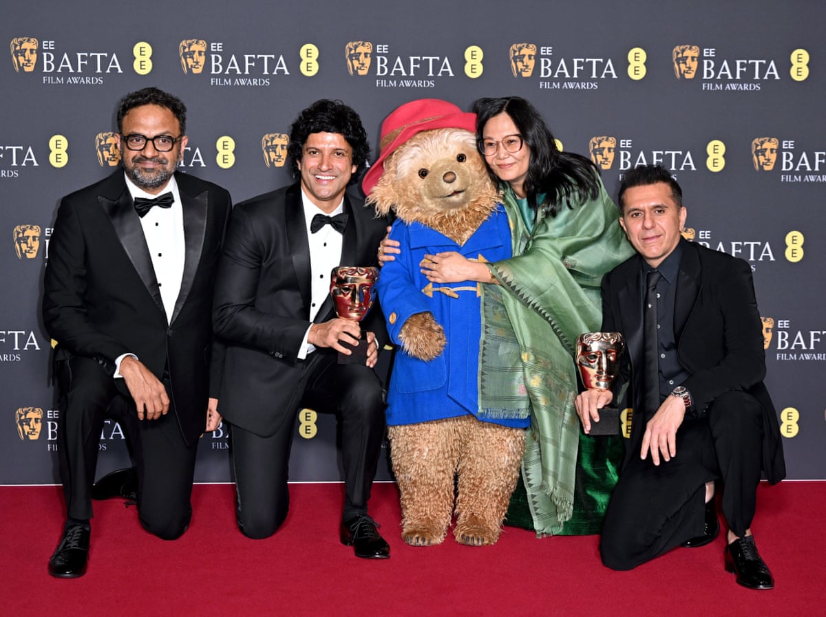 Boong makers Lakshmipriya Devi, Ritesh Sidhwani, Alan McAlex and Farhan Akhtar pose with Paddington. The film beat the likes of Lilo and Stitch and Zootropolis 2 to win best animation.