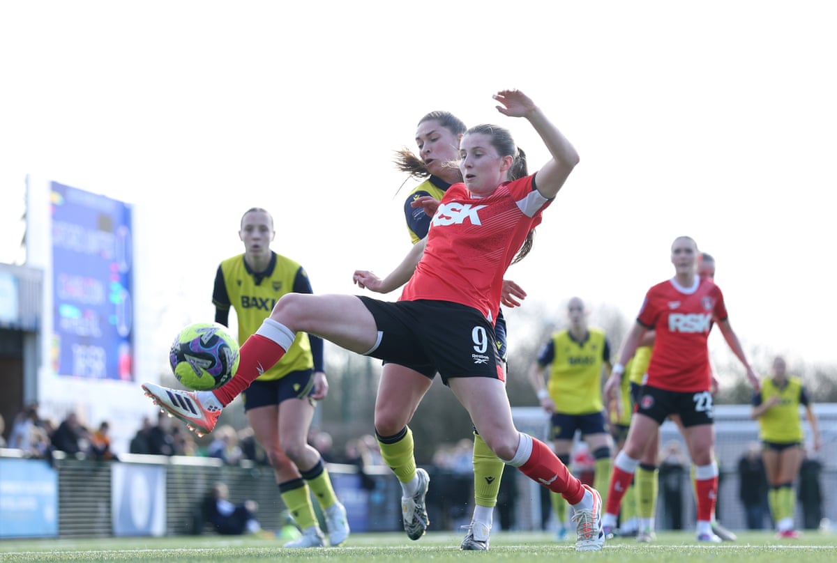 Emma Bissell of Charlton Athletic is challenged by Nicole Barrett of Oxford United.