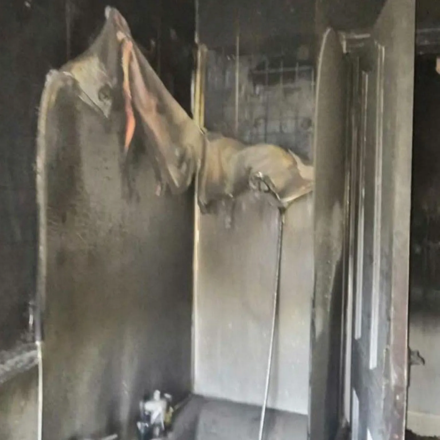 Becky Young A shower room melted and blackened after a house fire.
