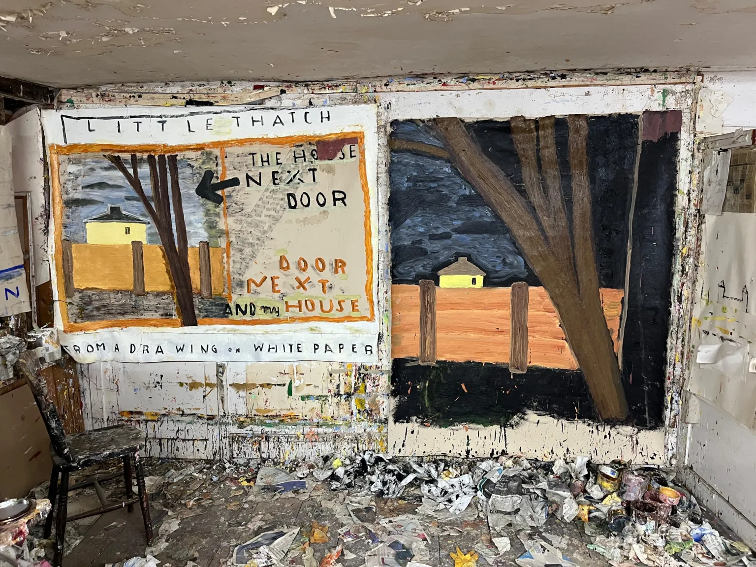 Painting showing on left -- yellow house behind brown fence and big tree on the right -- tree prominent and dark sky, smaller house and the frame looking like a meat cleaver with the words Little Thatch & The House Next door