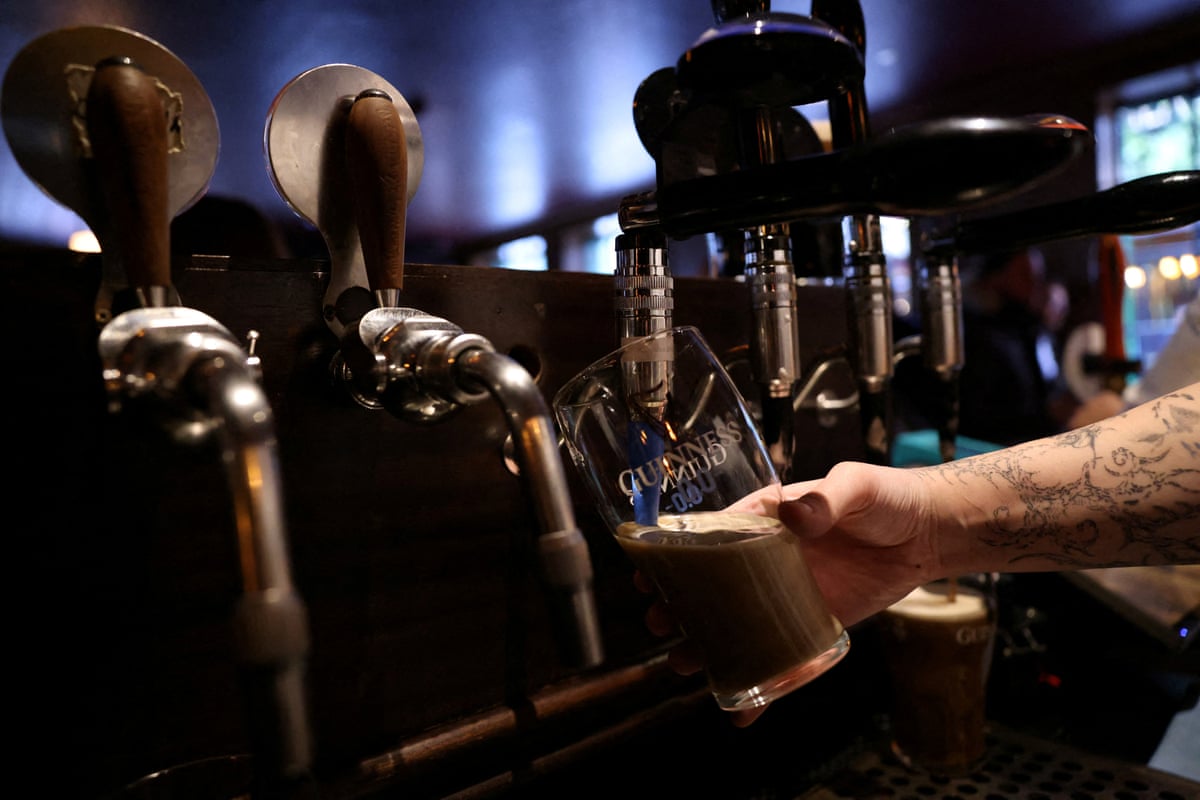 A bartender pours a Guinness 0.0 zero alcohol beer at The Devonshire pub in Soho, London.