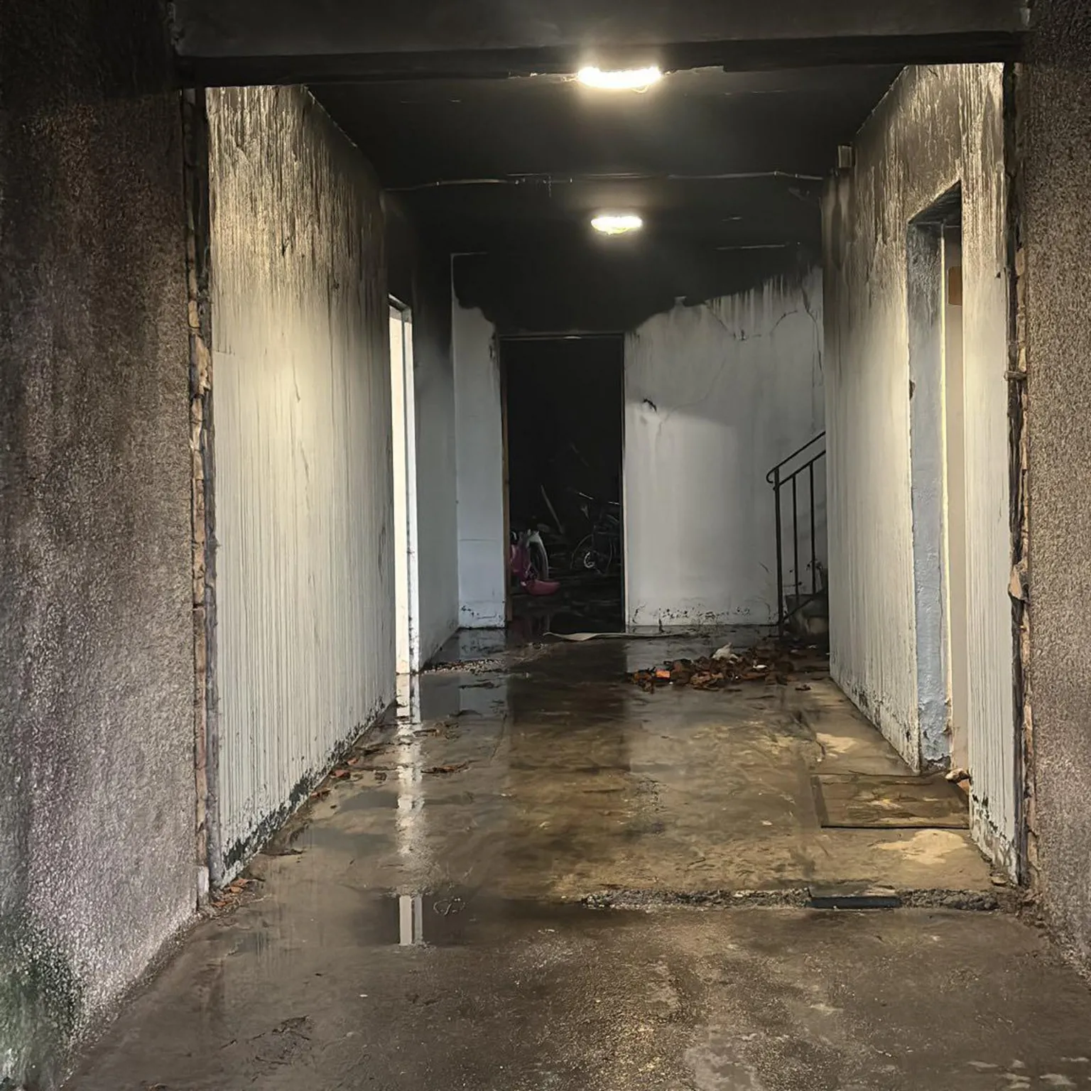 Alysha McLean The common close in the block of flats on Colquhon Road after the fire showing smoke damage.