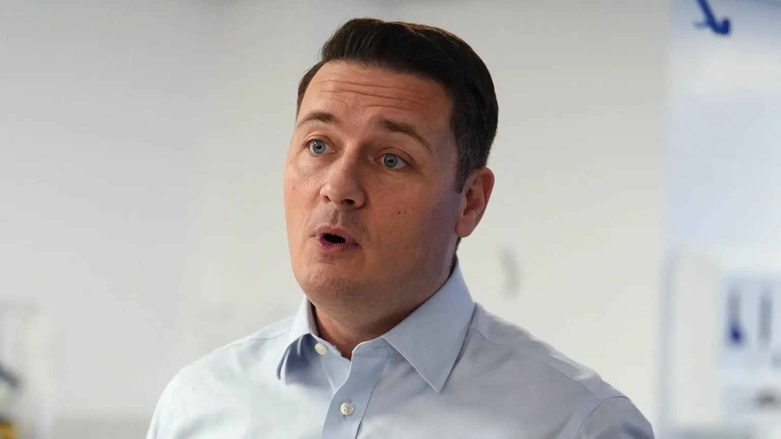 PA Health Secretary Wes Streeting in light blue shirt speaking to the media during a visit to the specialist surgical unit at Trafford General Hospital in Manchester