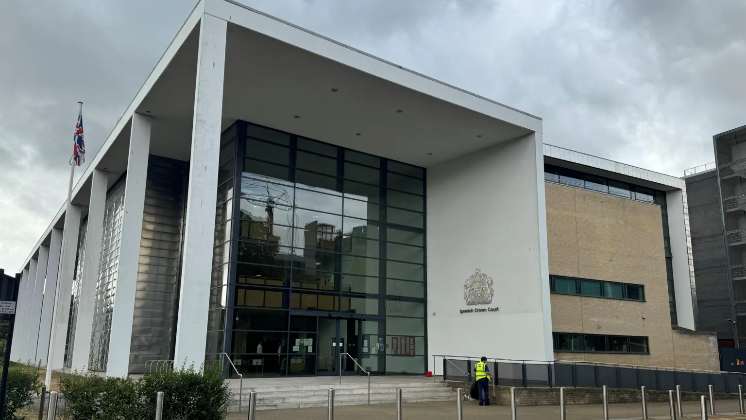 George King/BBC The Ipswich Crown Court building in Ipswich. The concrete and glass frontage can be seen, as can the emblem of the court on one of the walls.