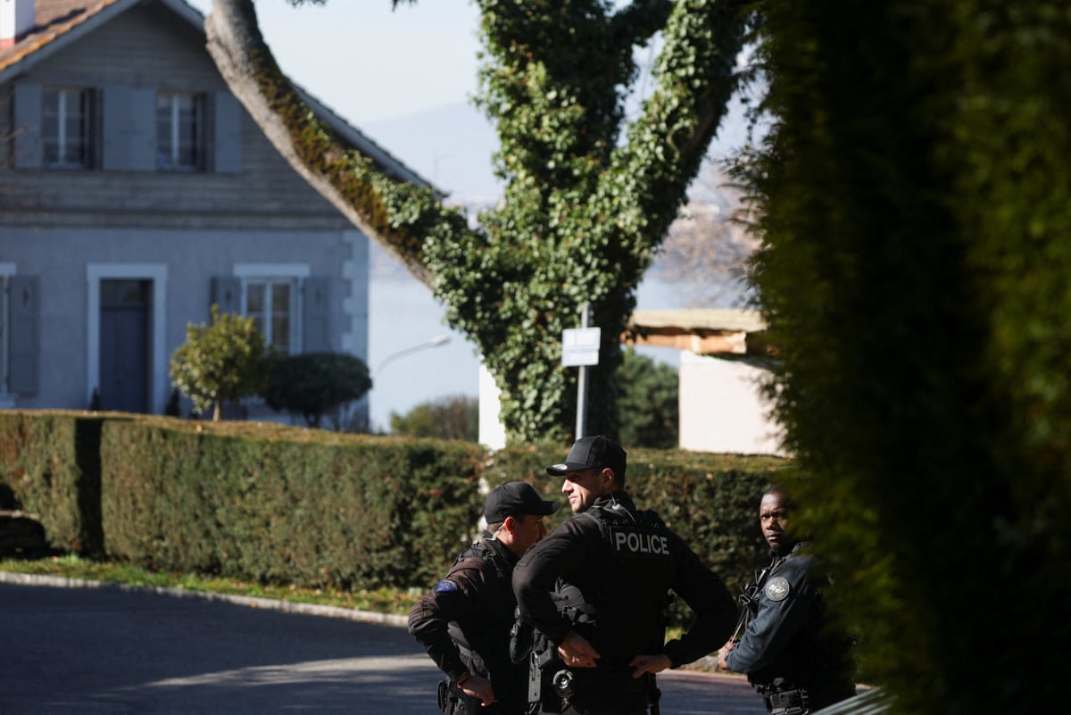 Officers stood outside a house.