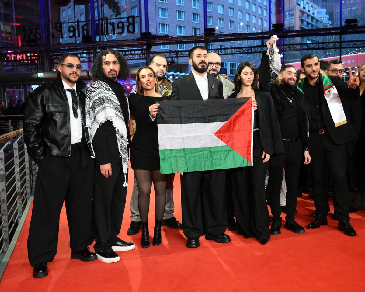 A group of people holding a flag
