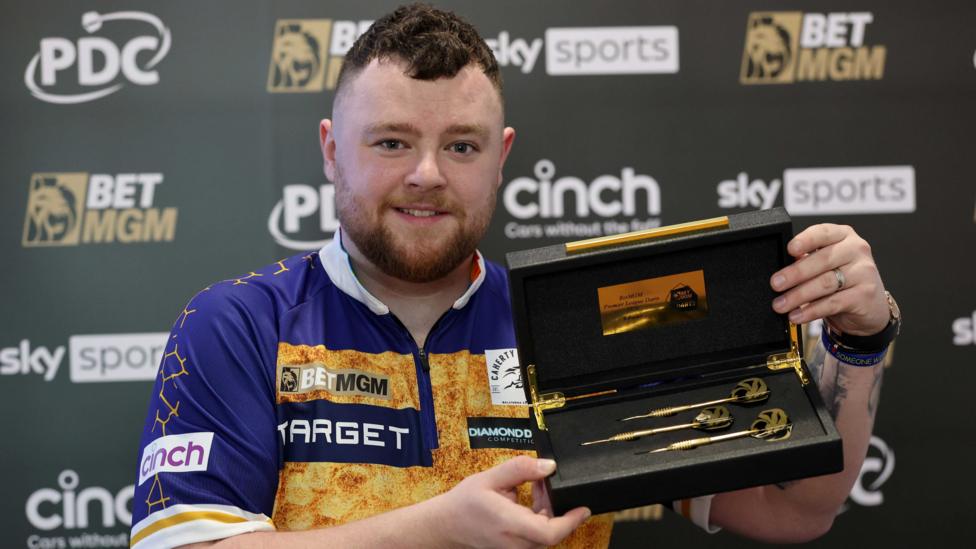 Josh Rock with 18ct darts after hitting a nine-darter in the Premier League event in Belfast