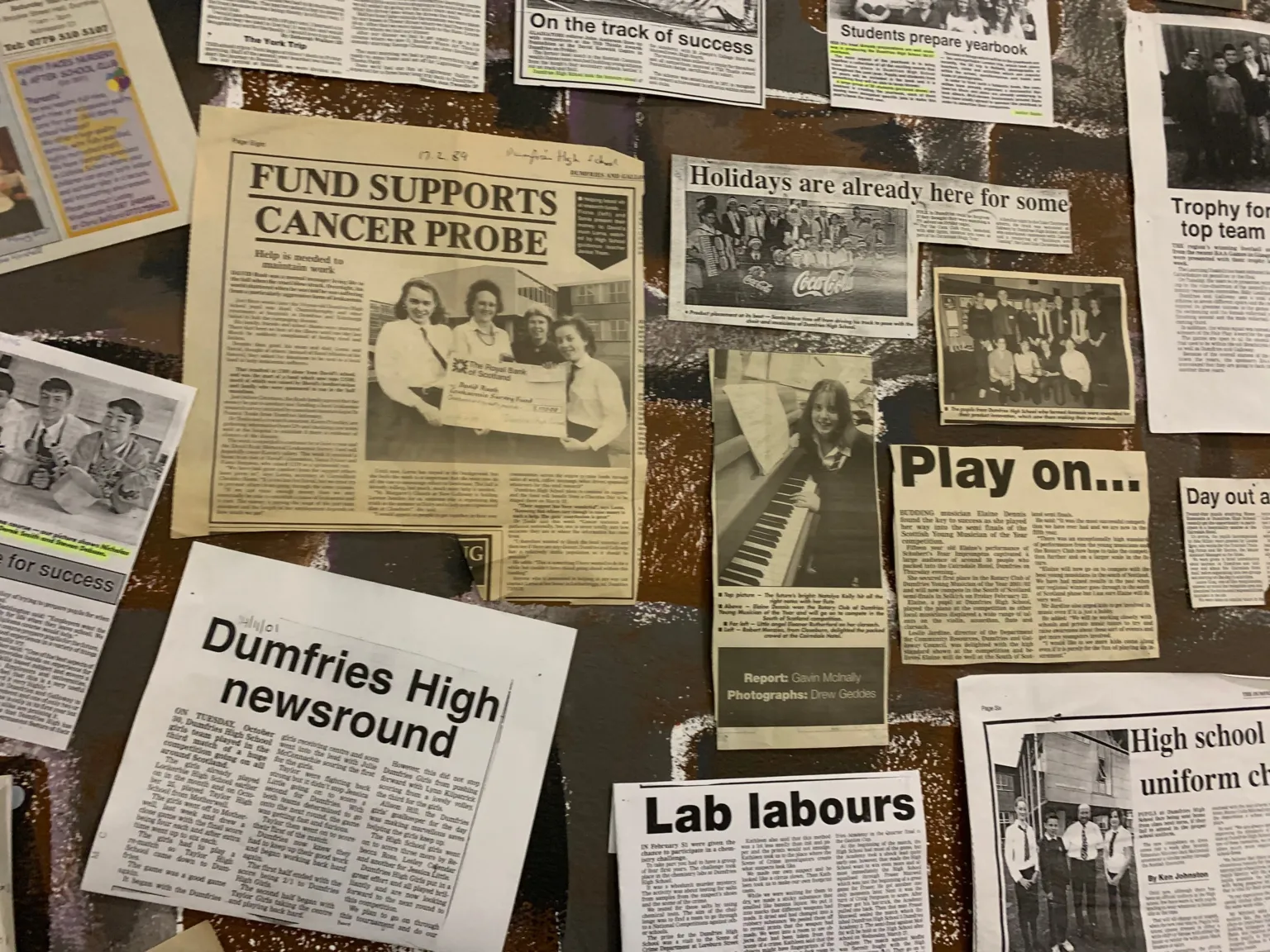 A selection of press clippings on a board
