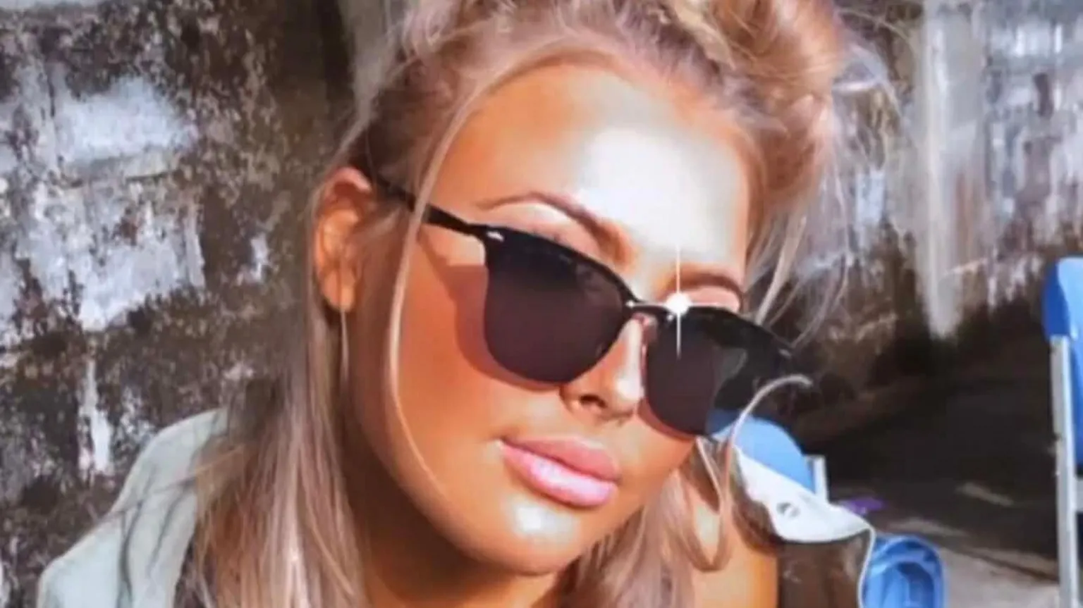 Danielle O'Halloran Picture of Chloe looking at the camera wearing sunglasses. There is a effect on the picture which is making it brighter and smoother.