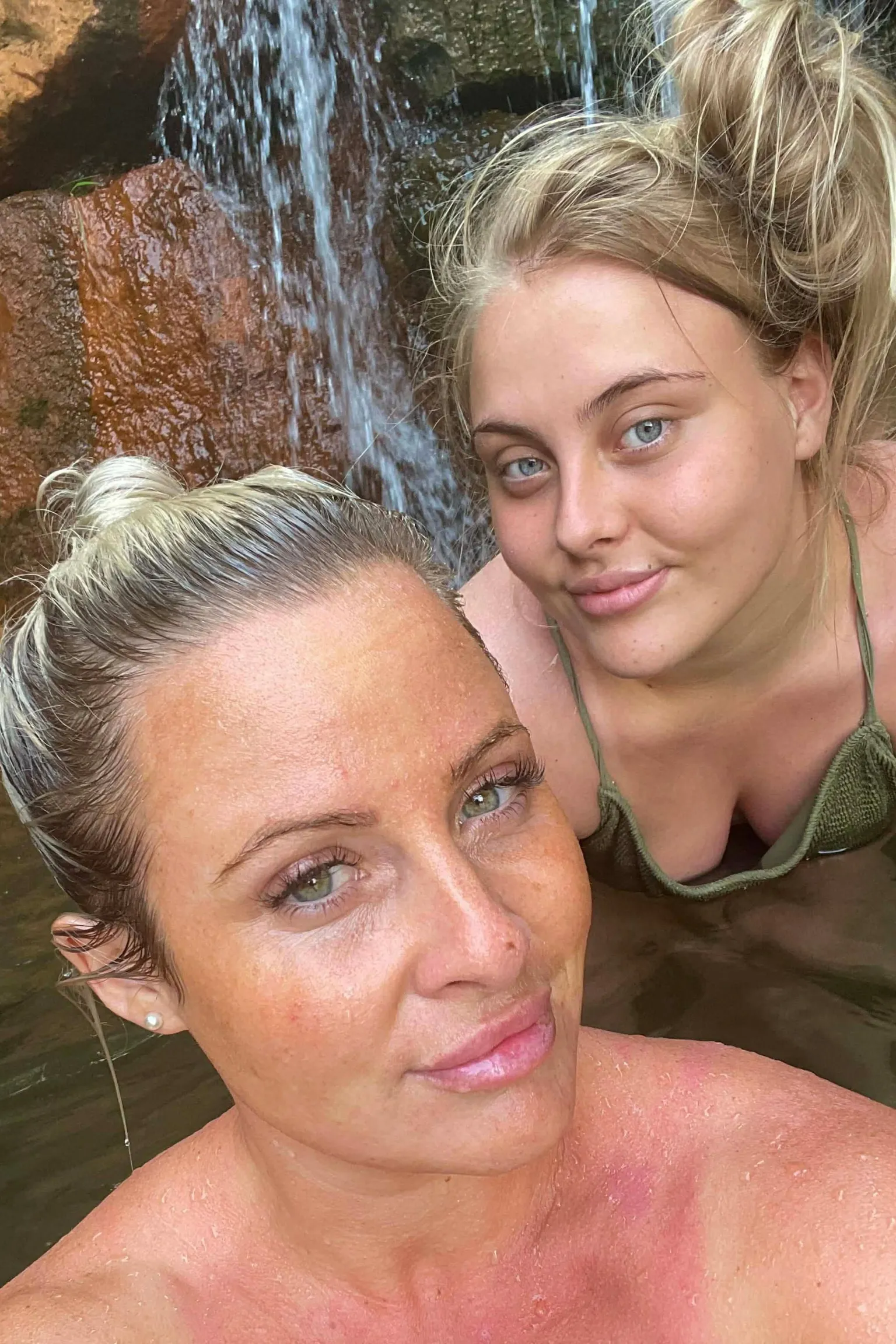 Danielle O'Halloran Selfie of Danielle and Chloe swimming in a lake. They are both smiling looking at the camera.