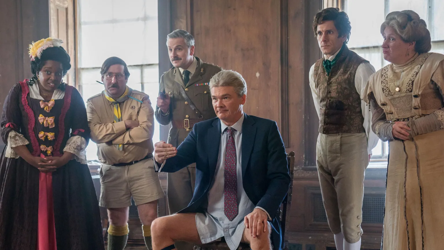 BBC/Monumental/Robbie Gray The characters of the show in a still from the TV series, all in costume in a row