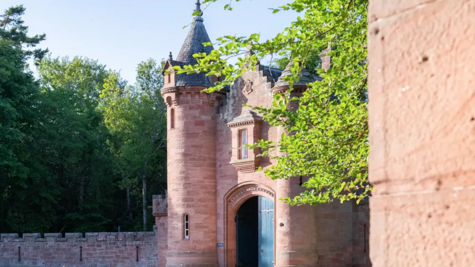 Knight Frank The entrance to the castle with a large arched gateway and turret