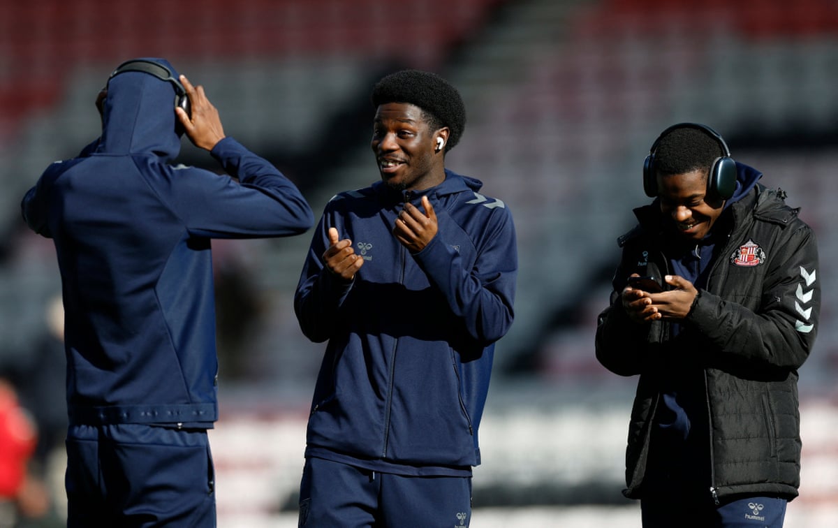 Eliezer Mayenda (centre) holds court on the pitch at the Vitality Stadium ahead of kick-off.