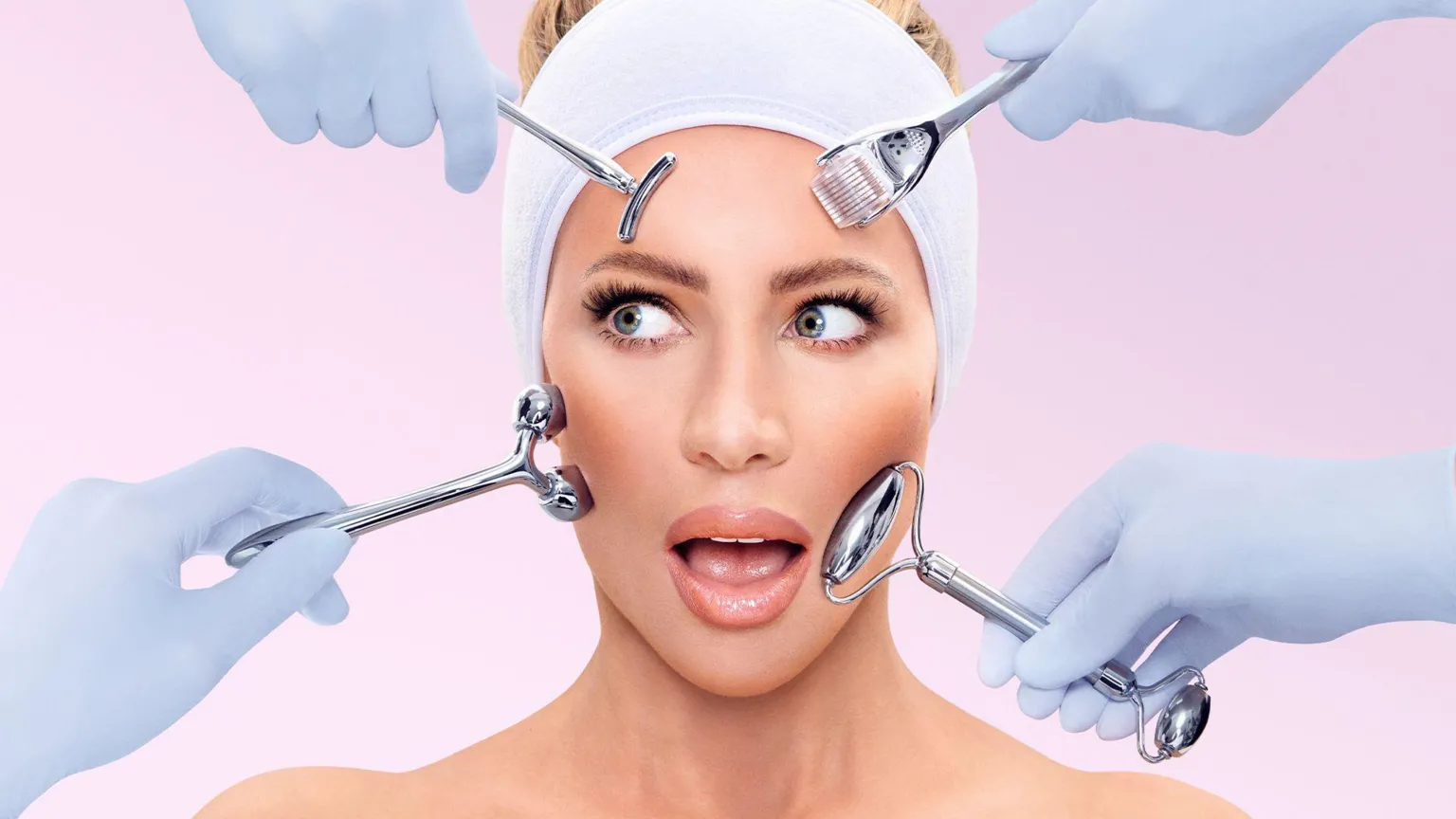ITV Picture of Olivia Attwood with beauty devices on her face and a shocked expression