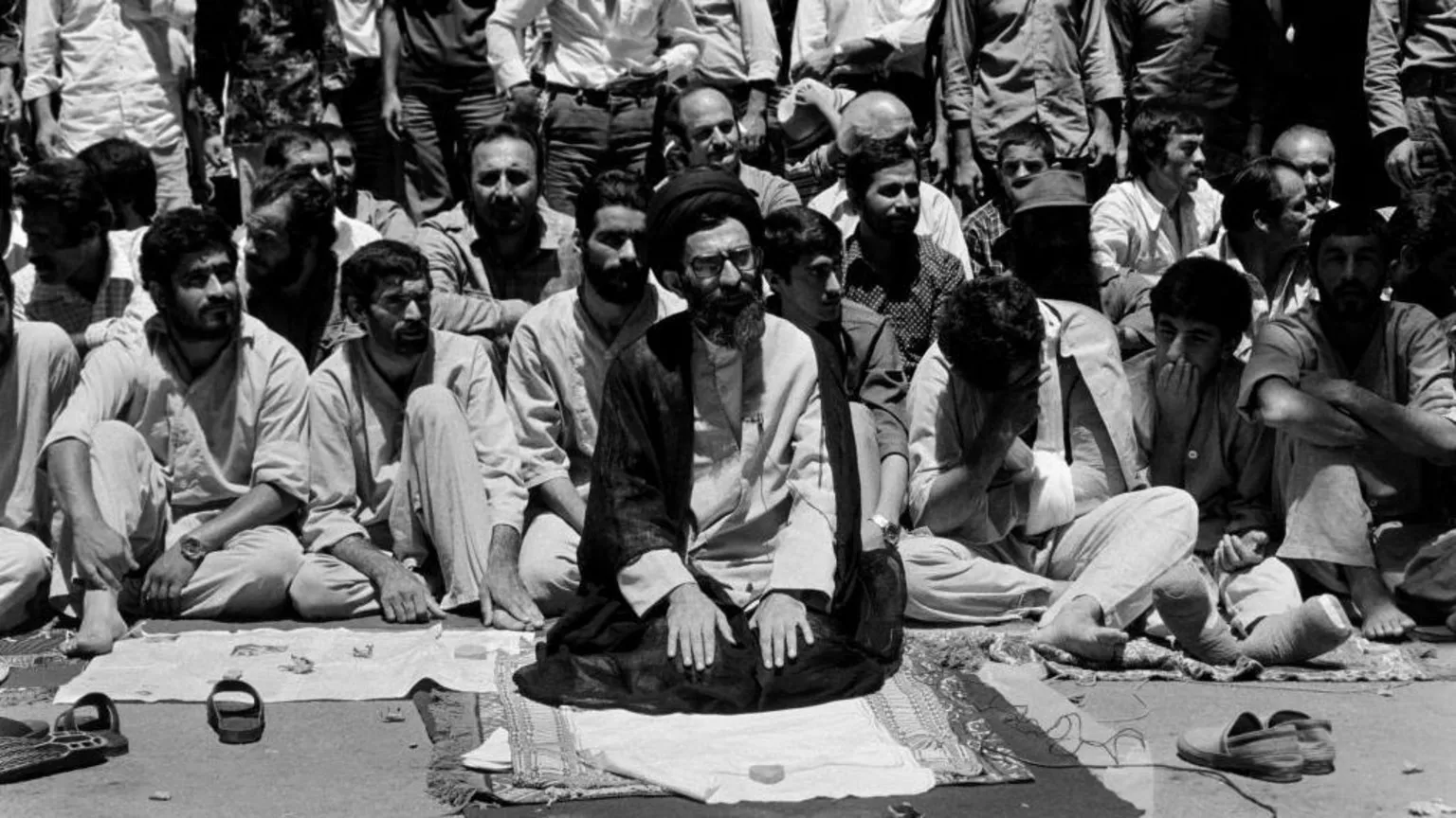 Gamma-Rapho via Ayatollah Khamenei at prayer in Tehran after the Iranian revolution in 1979