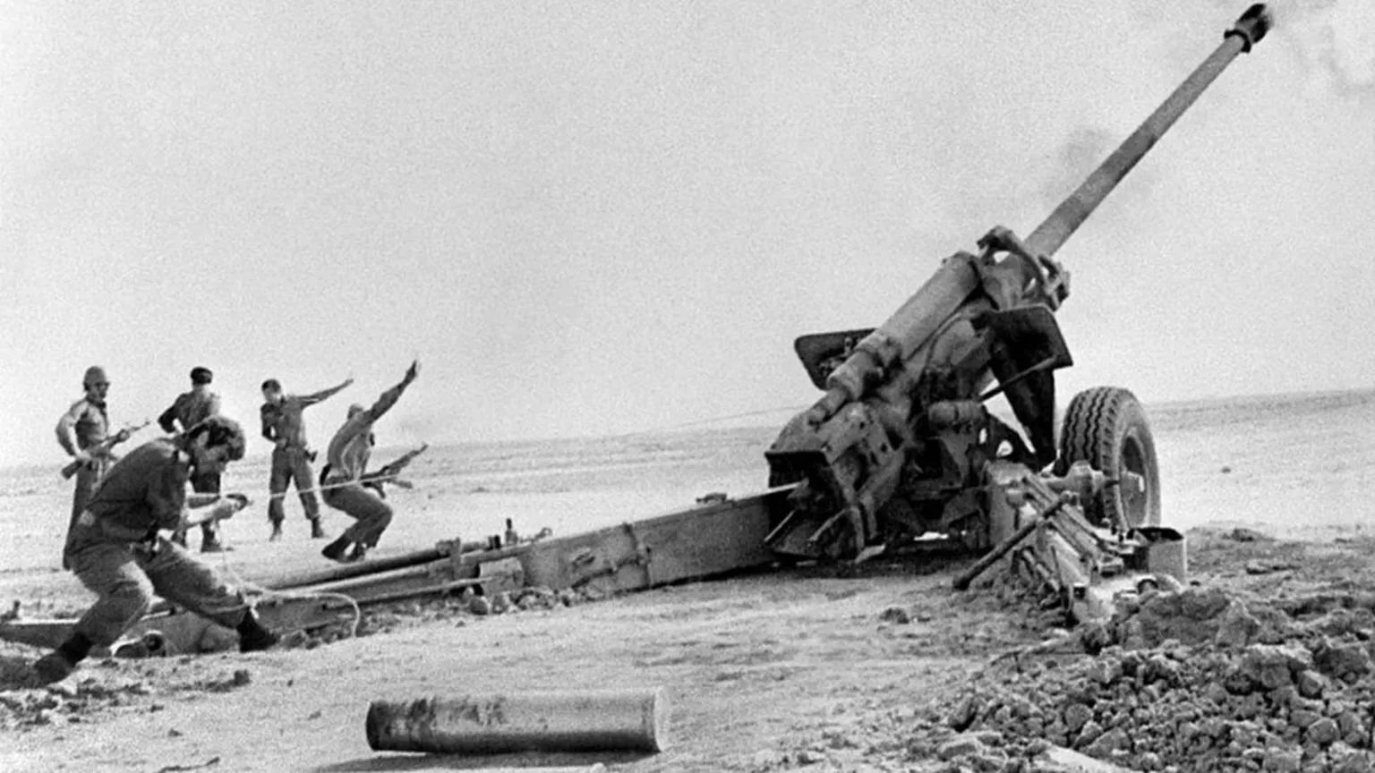 AFP via A black and white photo of Iraqi artillery shelling the Iranian town of Abadan during the Iran-Iraq war in 1980