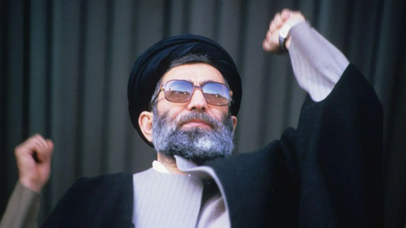 Hulton Archive via Ayatollah Khamenei making a speech in 1986. He is holding his arm aloft 