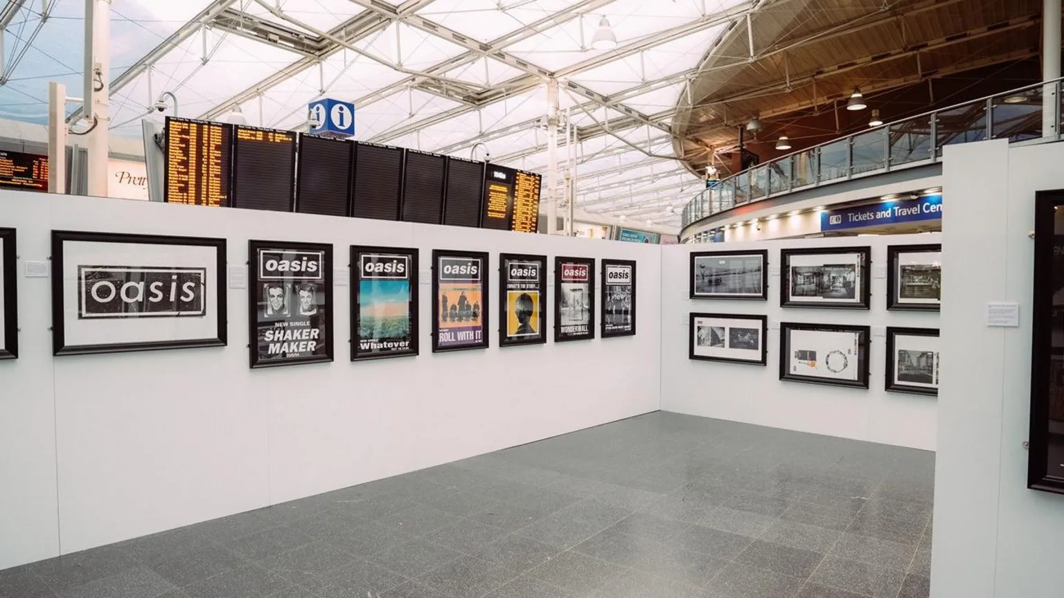 Ellen Offredy / Bad Bones Films A pop-up Microdot Design exhibition featuring iconic 1990s Oasis artwork by Brian Cannon on display at Manchester Piccadilly train station